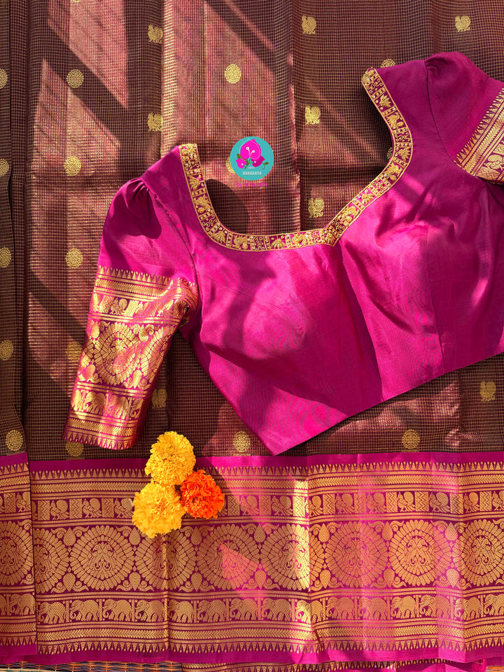 Pure Kanchipattu treasure in deep brown and Magenta color paired with hand embroidered blouse