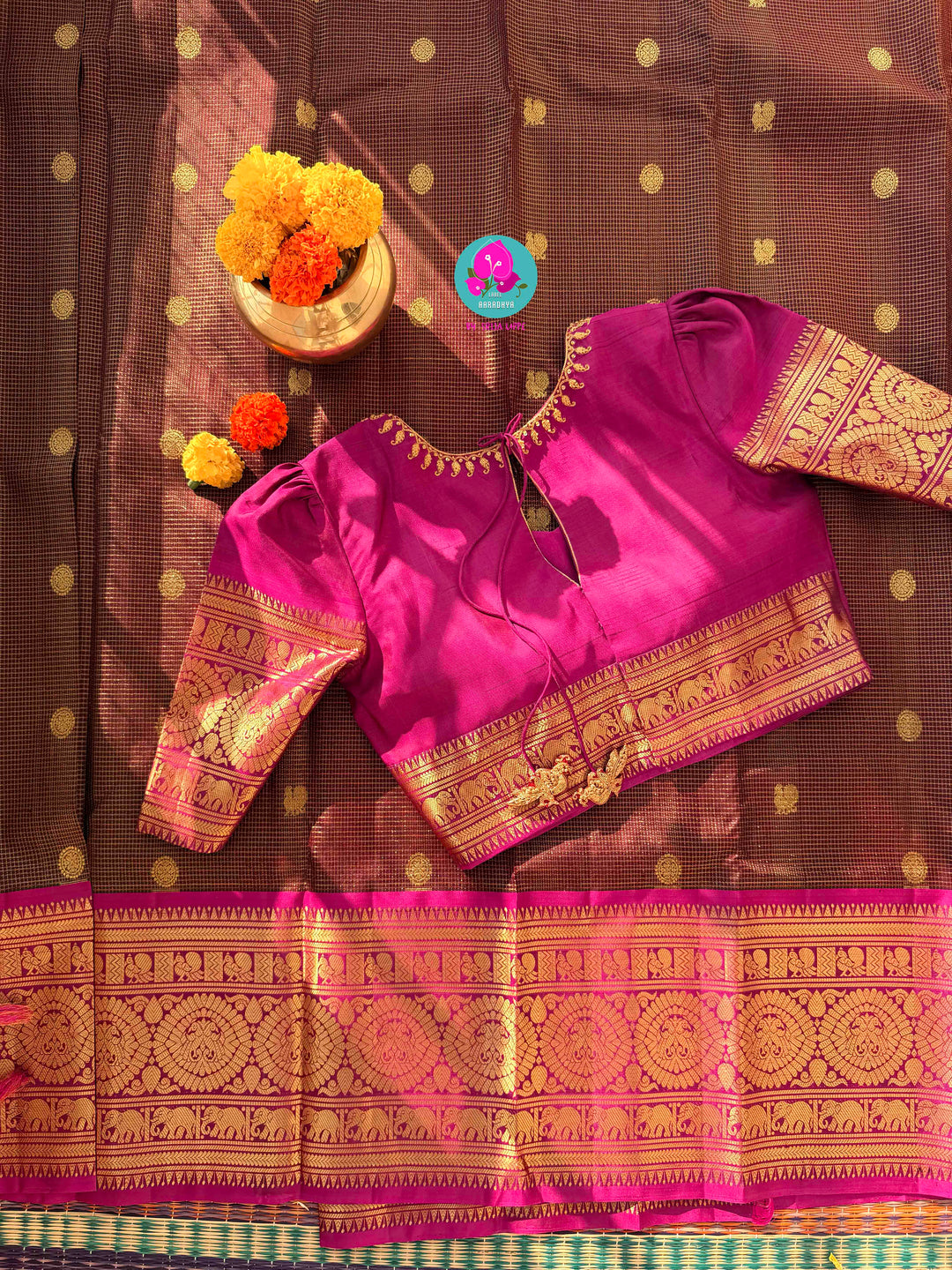 Pure Kanchipattu treasure in deep brown and Magenta color paired with hand embroidered blouse