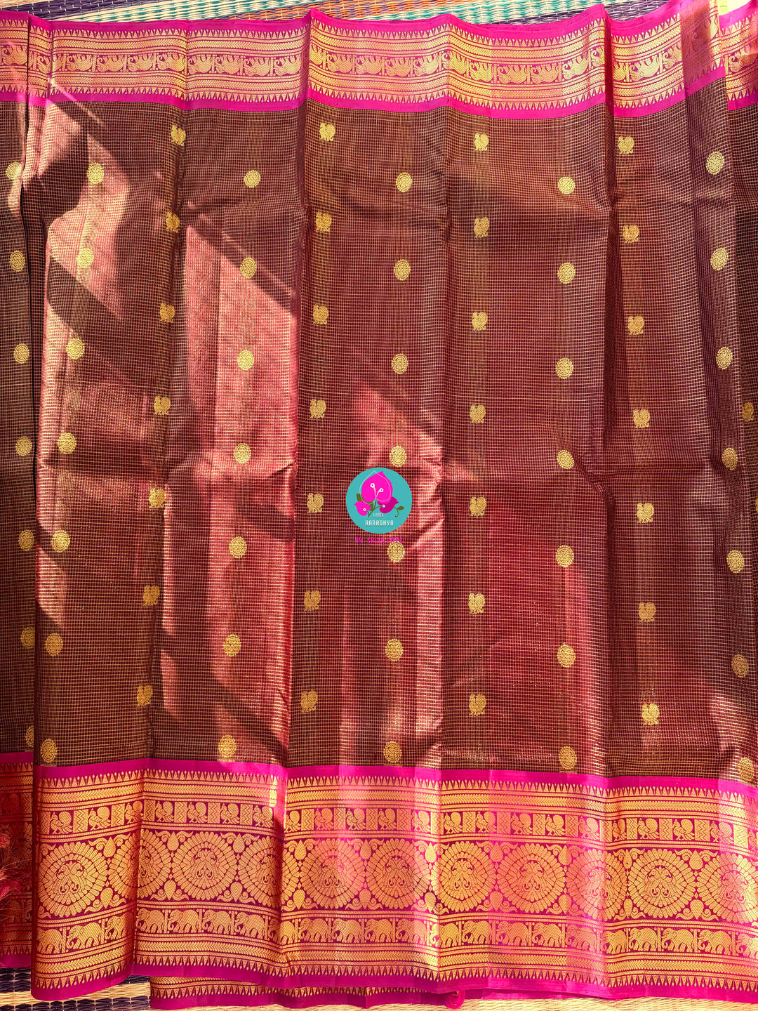 Pure Kanchipattu treasure in deep brown and Magenta color paired with hand embroidered blouse