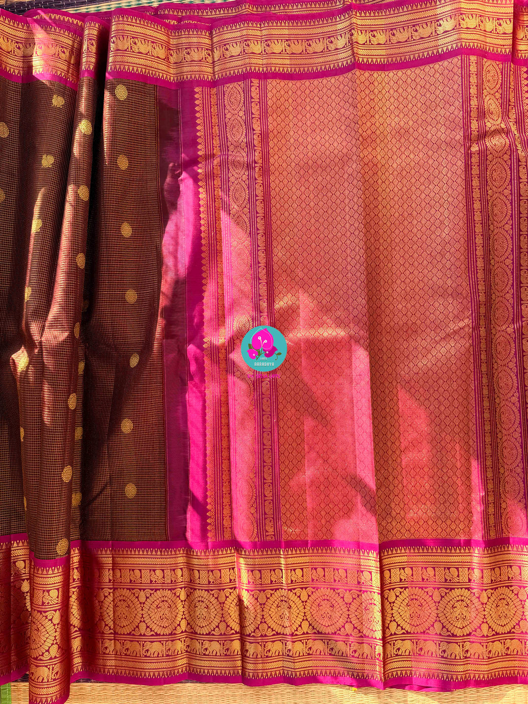 Pure Kanchipattu treasure in deep brown and Magenta color paired with hand embroidered blouse