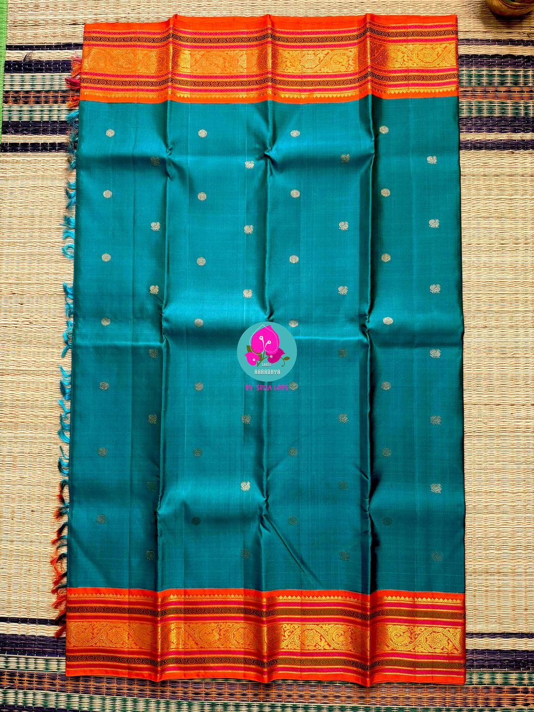 Night Sky Meets Sunrise: Dark Blue Kanjivaram Saree with Fiery Orange Contrast