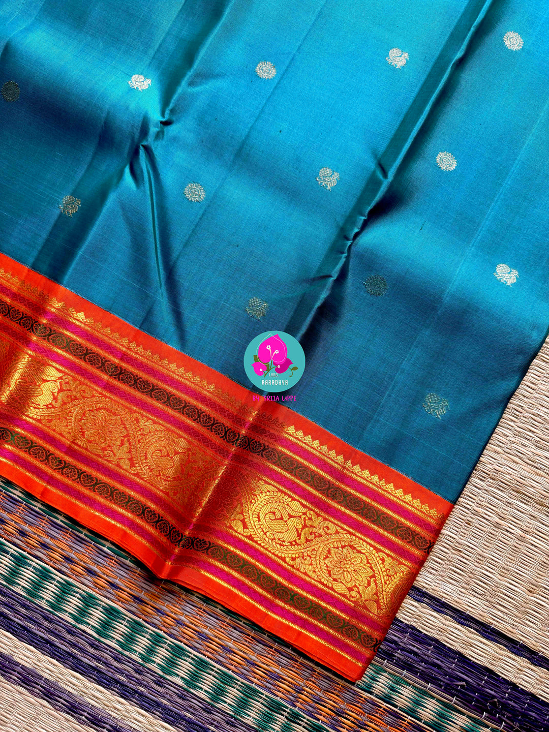 Night Sky Meets Sunrise: Dark Blue Kanjivaram Saree with Fiery Orange Contrast