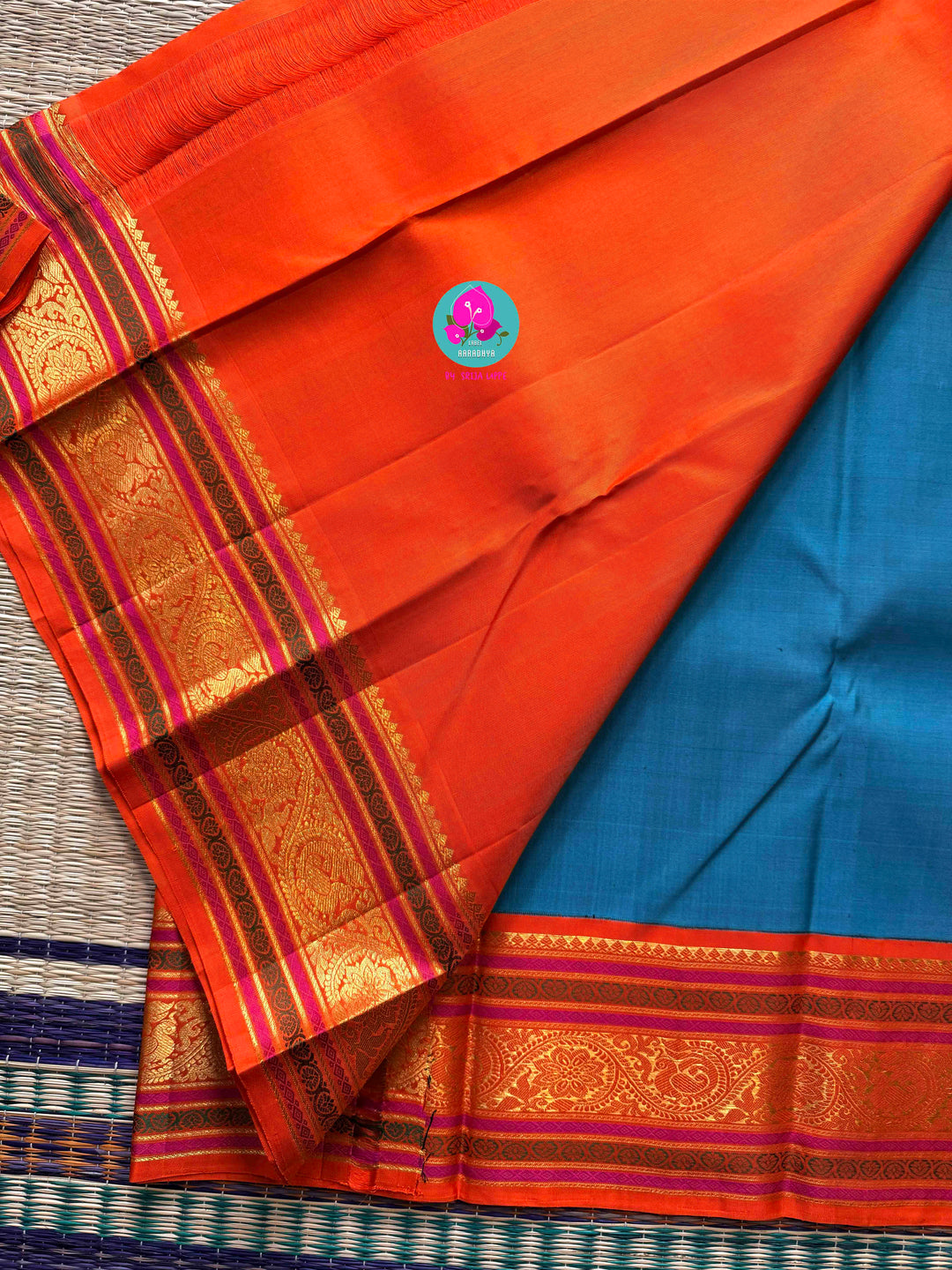 Night Sky Meets Sunrise: Dark Blue Kanjivaram Saree with Fiery Orange Contrast