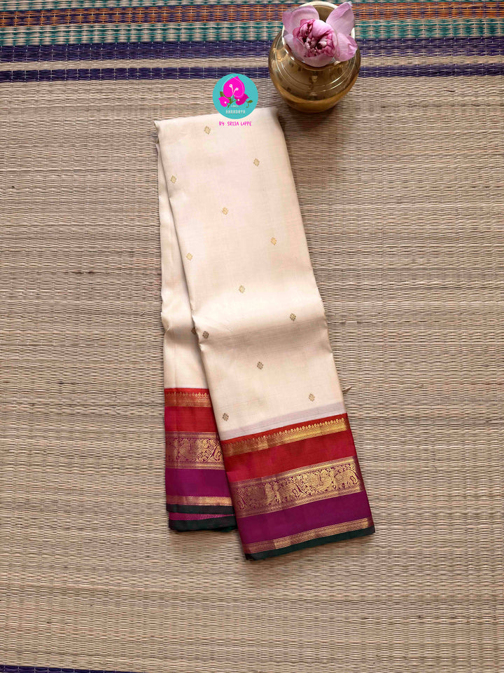 Serene Purity: Vintage Off-White Kanjivaram Saree with Rich Festive Contrast