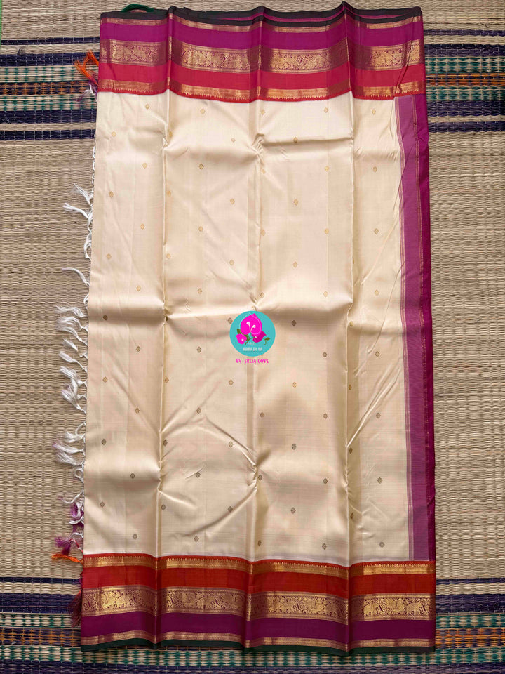 Serene Purity: Vintage Off-White Kanjivaram Saree with Rich Festive Contrast