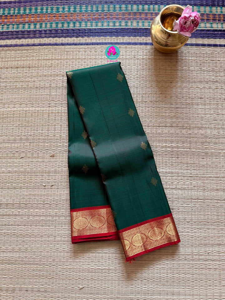 Auspicious Art: Bottle Green Kanchivaram silk Saree with Intricate Kolam Motif Weave