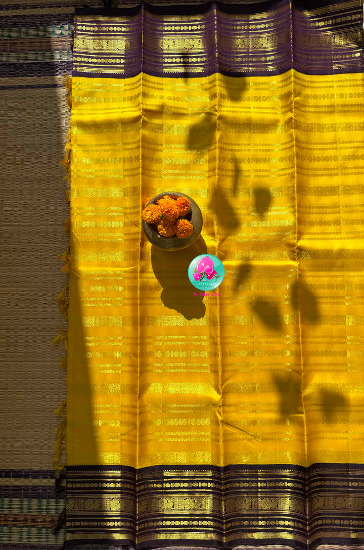 Golden Haldi & Imperial Purple: Vibrant Yellow 2G Zari Kanchi Silk Saree with Purple Baldari Border