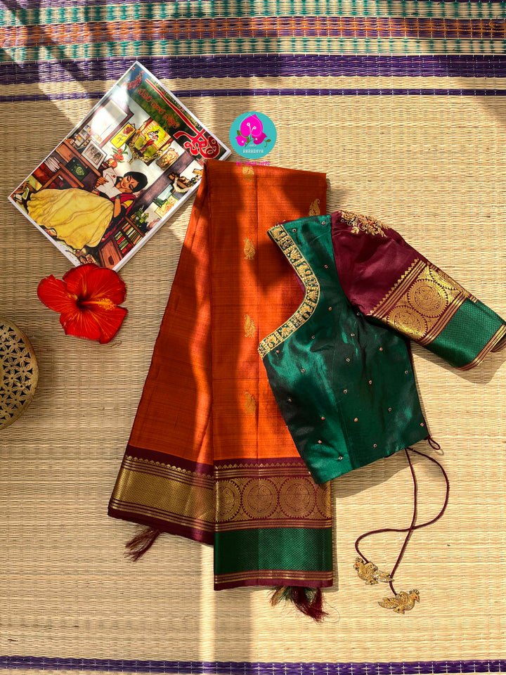 Kanchipattu handloom saree warm rust orange by a contrast border in sophisticated brown and a touch of vibrant green