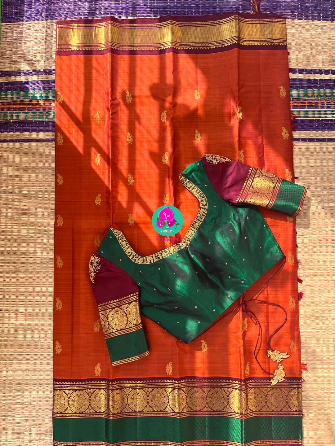 Kanchipattu handloom saree warm rust orange by a contrast border in sophisticated brown and a touch of vibrant green