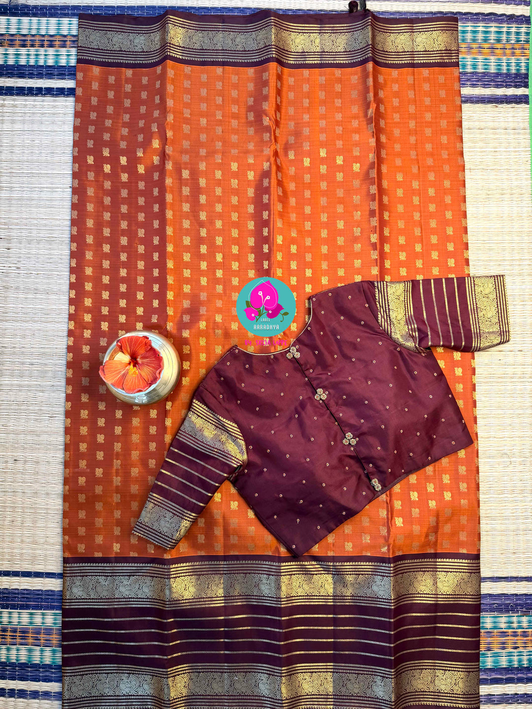 Earth's Glow: Vintage Orange Kanchipattu Saree with Majestic Peacock Border