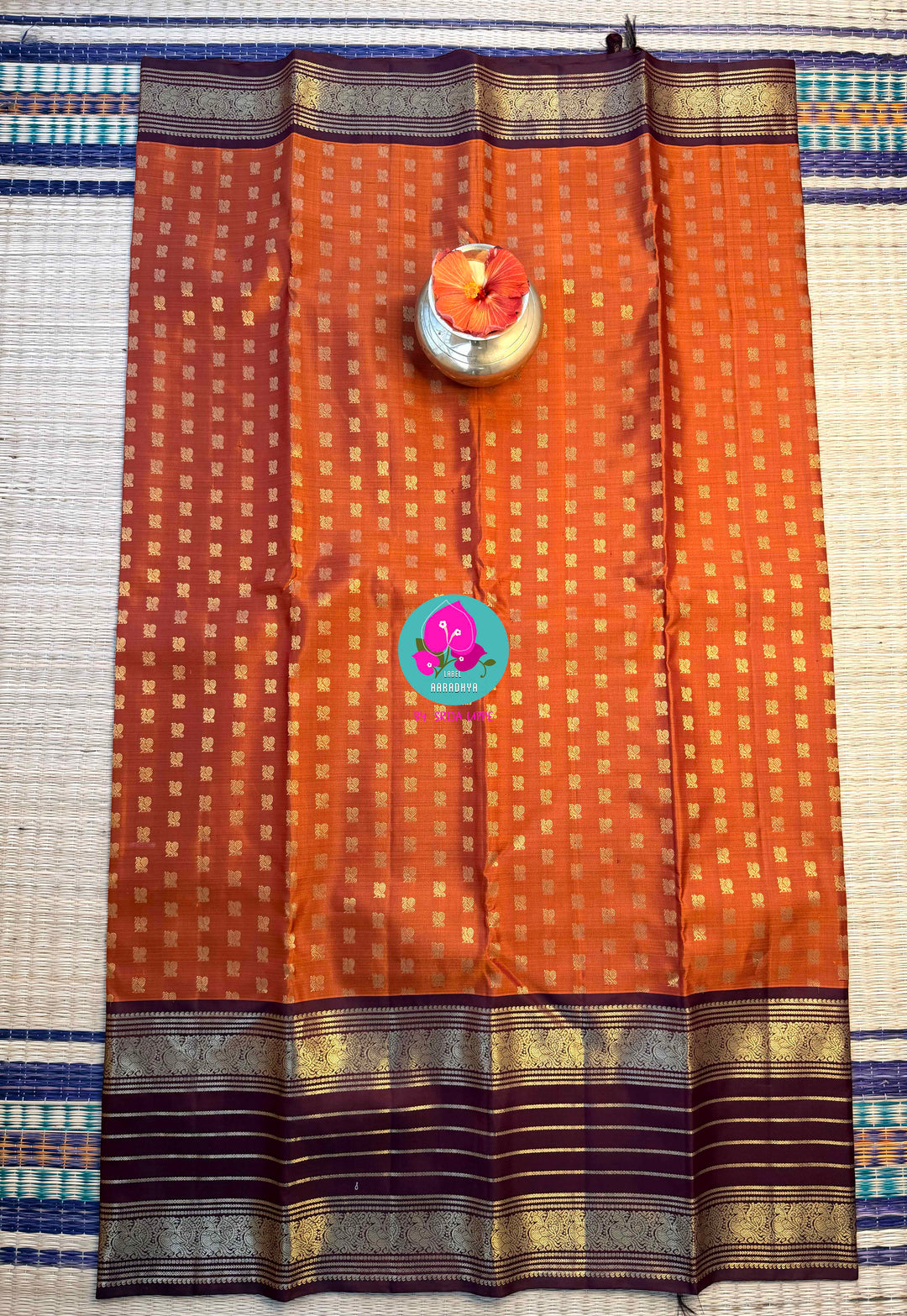 Earth's Glow: Vintage Orange Kanchipattu Saree with Majestic Peacock Border