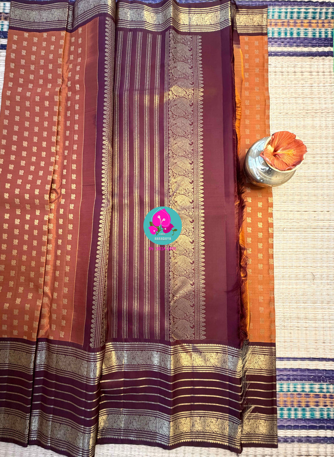 Earth's Glow: Vintage Orange Kanchipattu Saree with Majestic Peacock Border