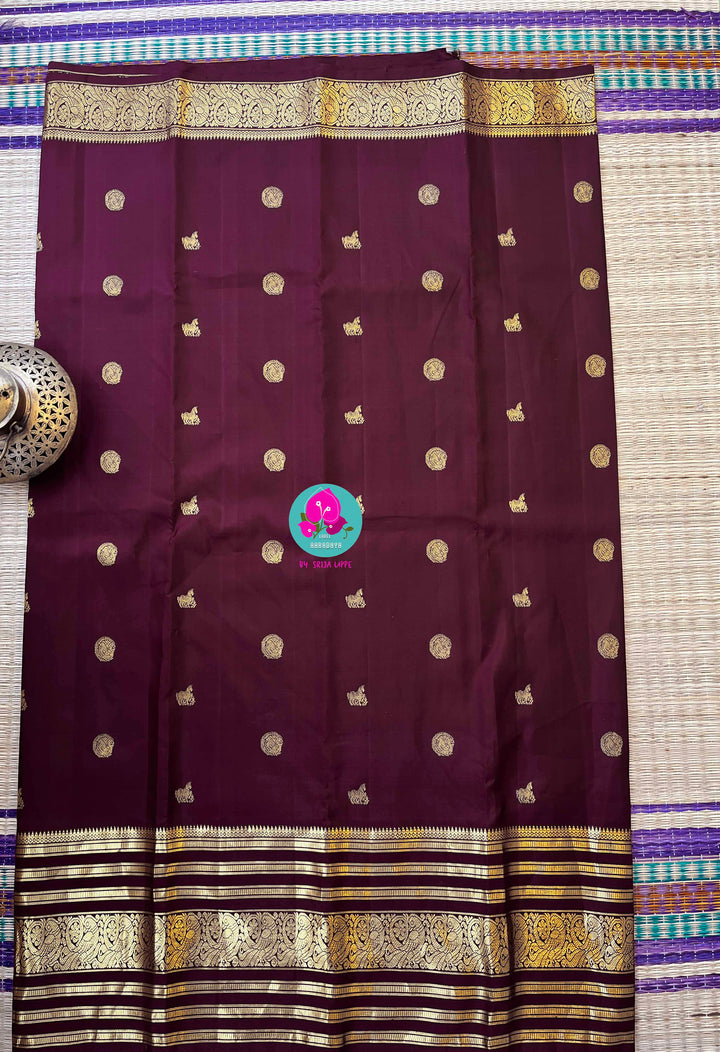 Kanchipuram 2g zari brown vintage saree in big border paired with hand embroidered blouse