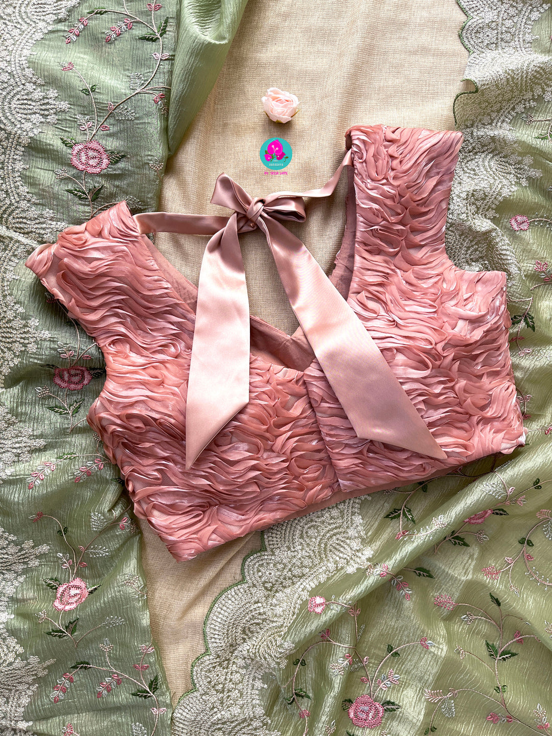 Crushed soft organza saree with Rose embroidery paired with Ribbon blouse