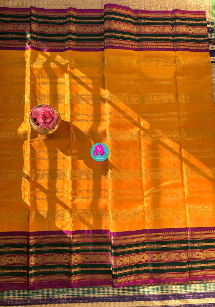 The 3G Zari Grandeur: Vintage Yellow Saree with Forest Green & Purple Edge with Hand embroidered blouse