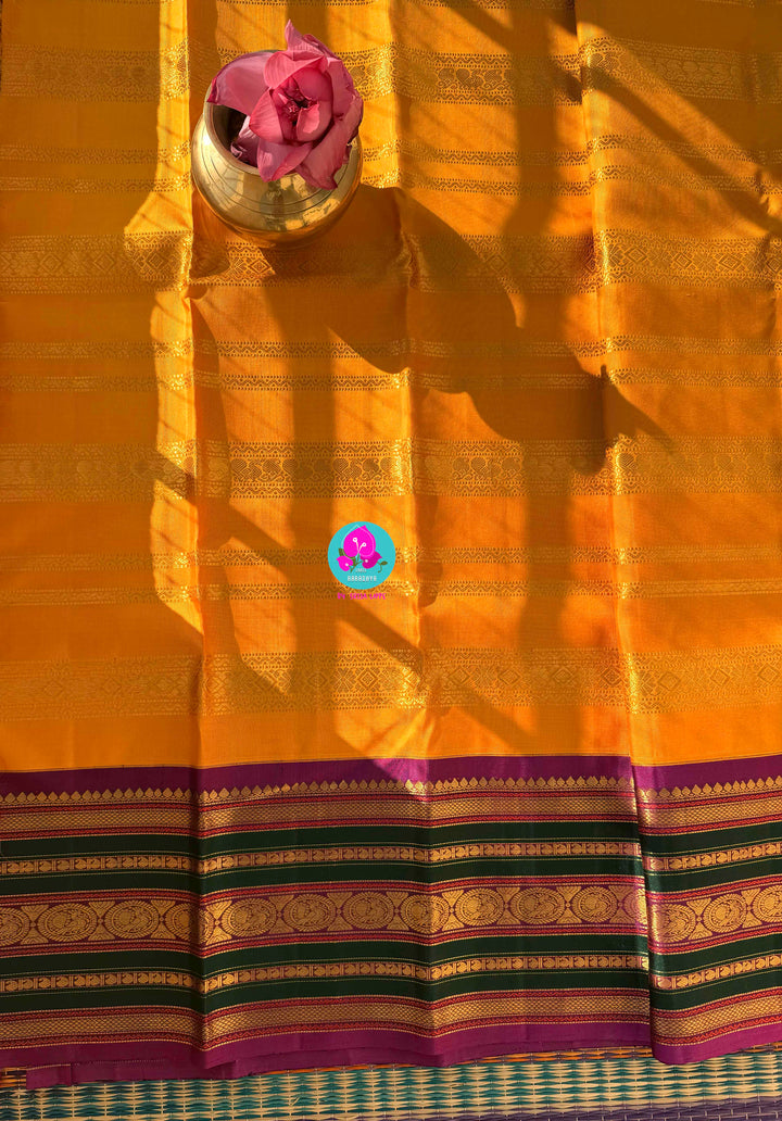 The 3G Zari Grandeur: Vintage Yellow Saree with Forest Green & Purple Edge with Hand embroidered blouse