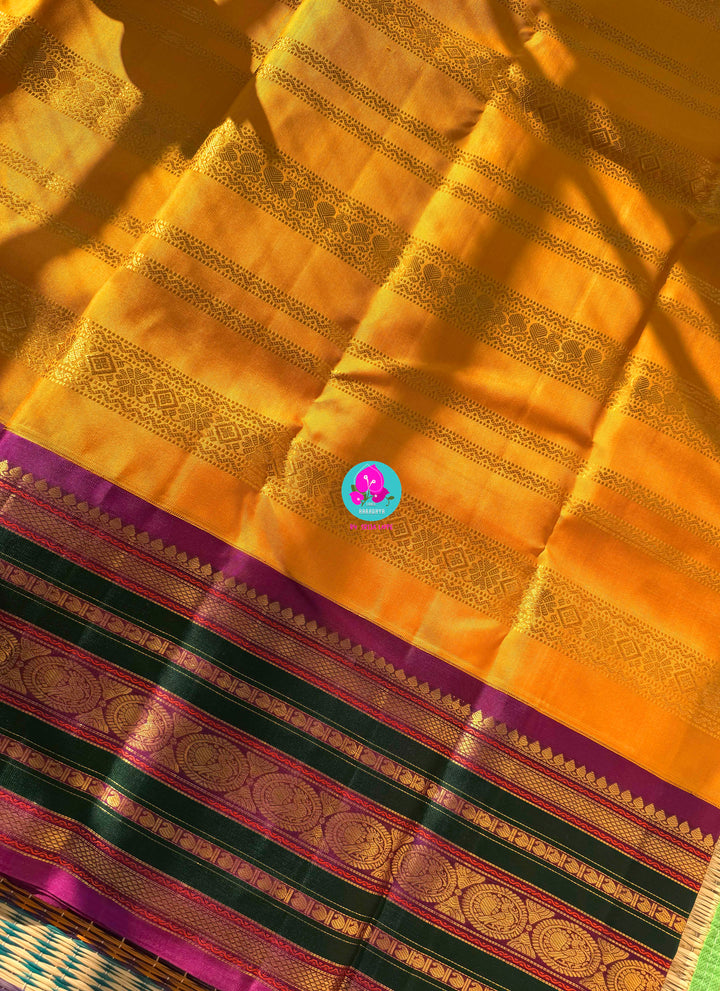 The 3G Zari Grandeur: Vintage Yellow Saree with Forest Green & Purple Edge with Hand embroidered blouse