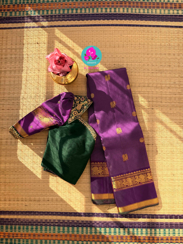 2g zari Vaira Oosi check butta saree in beautiful shade of purple with Hand Embroidered bottle green color fusion Blouse