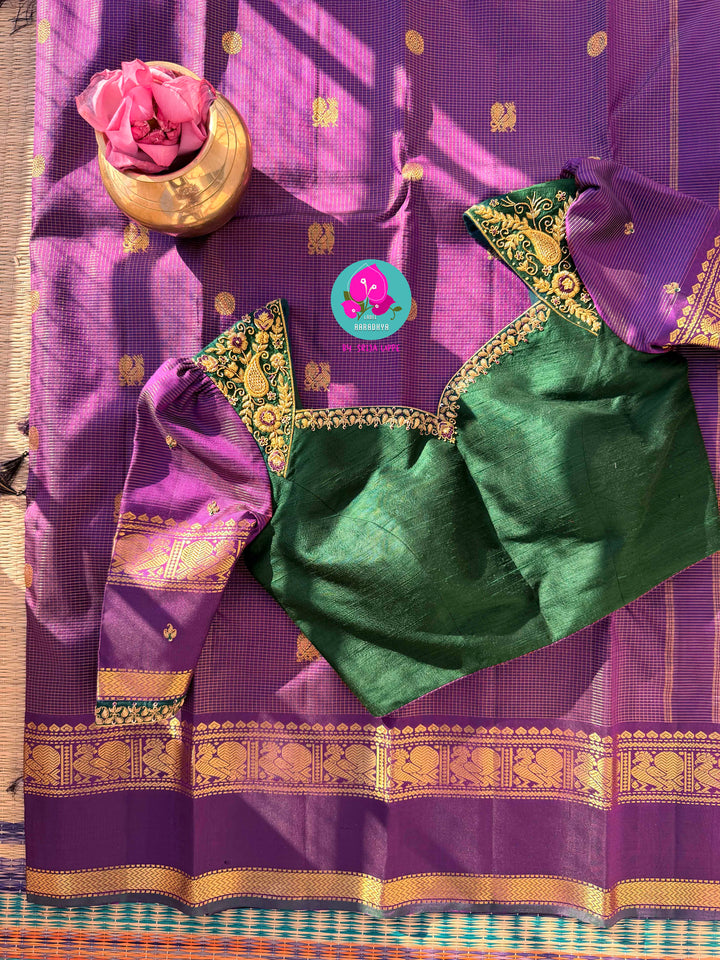 2g zari Vaira Oosi check butta saree in beautiful shade of purple with Hand Embroidered bottle green color fusion Blouse