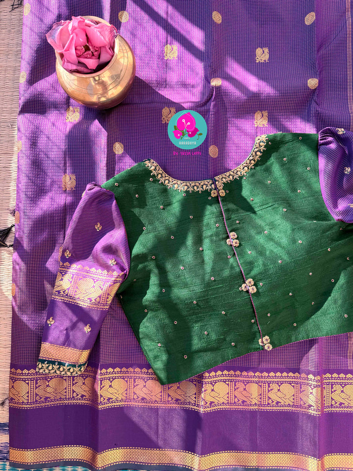 2g zari Vaira Oosi check butta saree in beautiful shade of purple with Hand Embroidered bottle green color fusion Blouse