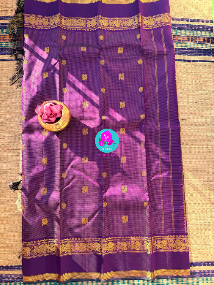 2g zari Vaira Oosi check butta saree in beautiful shade of purple with Hand Embroidered bottle green color fusion Blouse