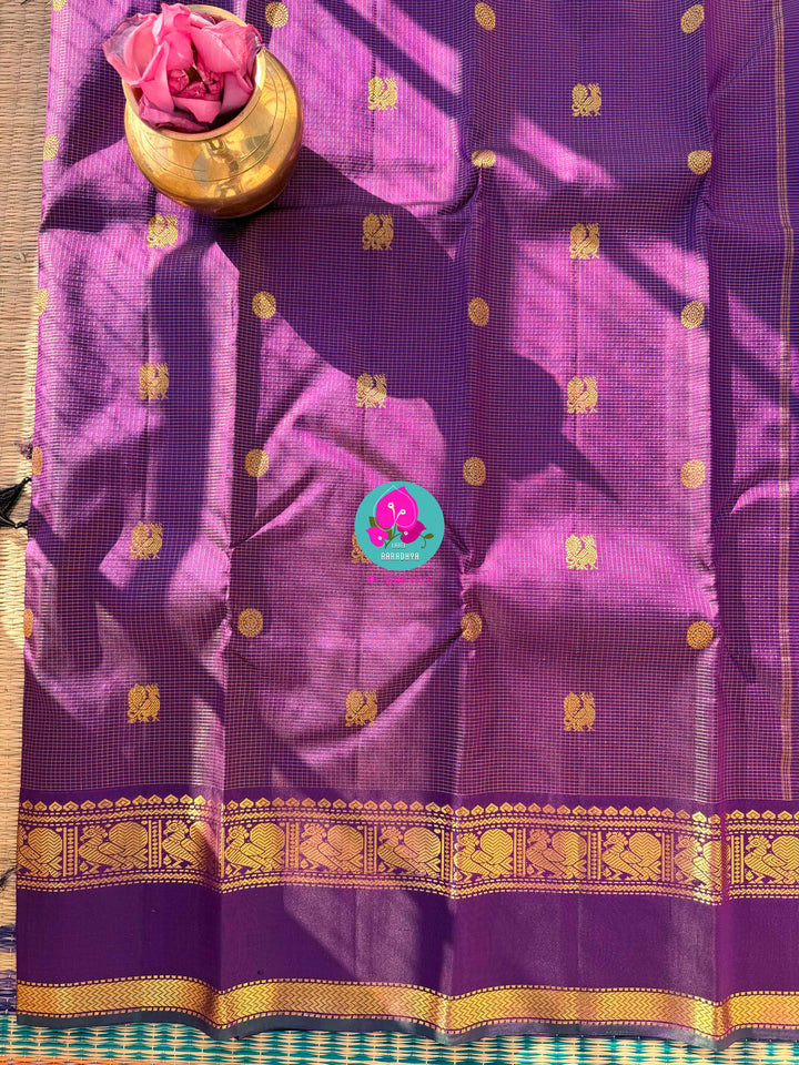 2g zari Vaira Oosi check butta saree in beautiful shade of purple with Hand Embroidered bottle green color fusion Blouse