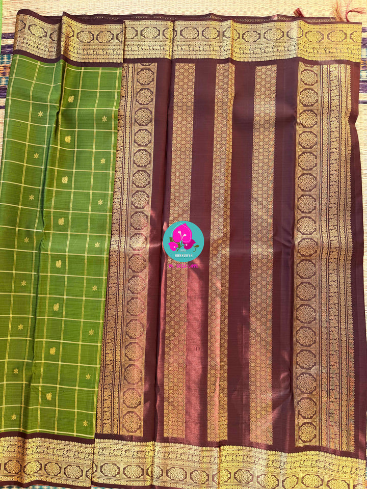 Nature inspired colors pattu saree in green and brown with hand embroidered blouse