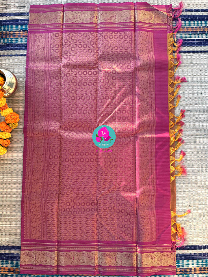 Fenugreek shade  Kanjivaram Vaira Oosi saree with Bold Pink Contrast and Embroidered Blouse