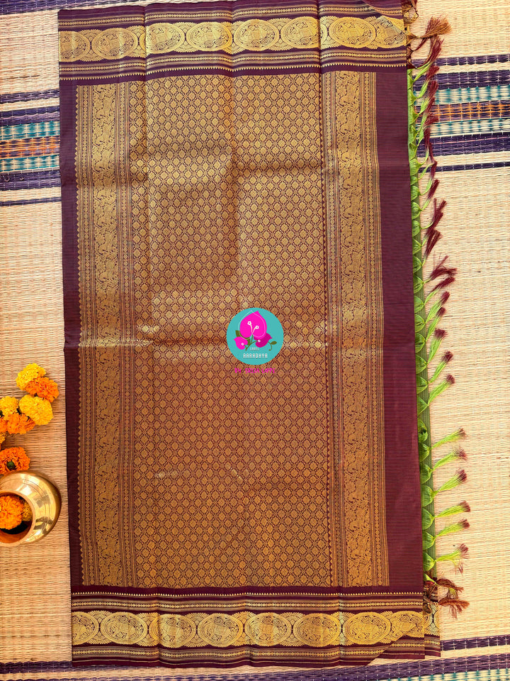 Mehendi green Kanjivaram Vaira Oosi with Bold brownish purple Contrast and Embroidered Blouse