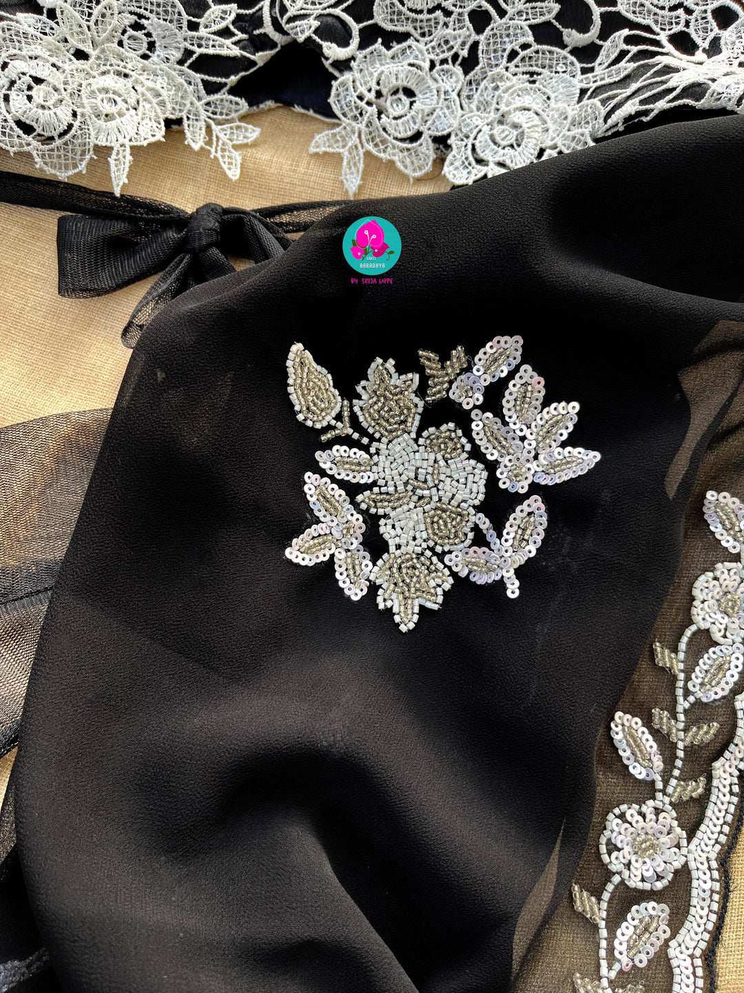 Hand embroidered georgette Ariel saree Paired white Rosy netted blouse with sequins