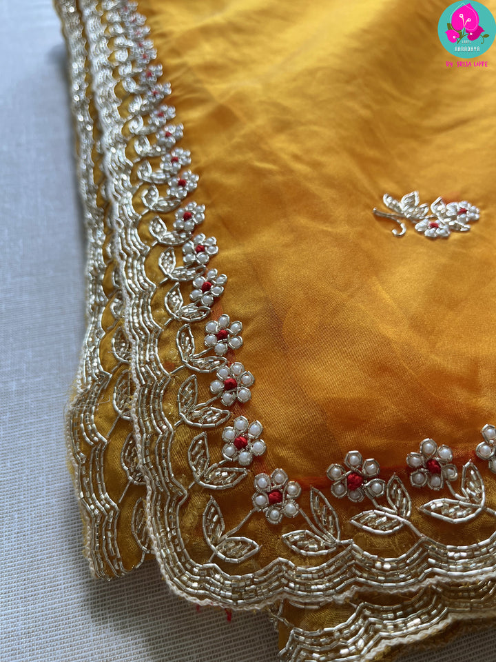 Mustard soft organza silk hand embroidered saree with beautiful pearl, silver cutdana, bead and zardosi