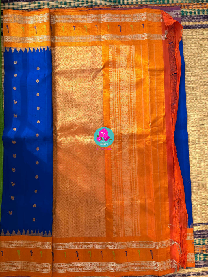 Sapphire Skies & Sunset Glow: Pure Tissue Gadwal Saree with Muniya Grandeur and Stone-Encrusted Artistry