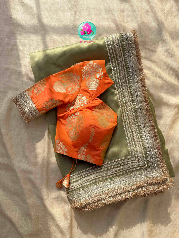 Ethereal Metallic Glow: Light Green Gold Tissue Organza Saree & Sunburst Orange Brocade Blouse