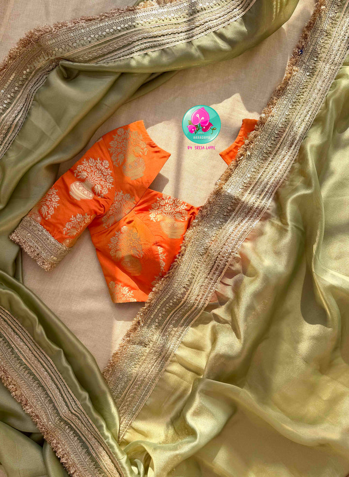 Ethereal Metallic Glow: Light Green Gold Tissue Organza Saree & Sunburst Orange Brocade Blouse