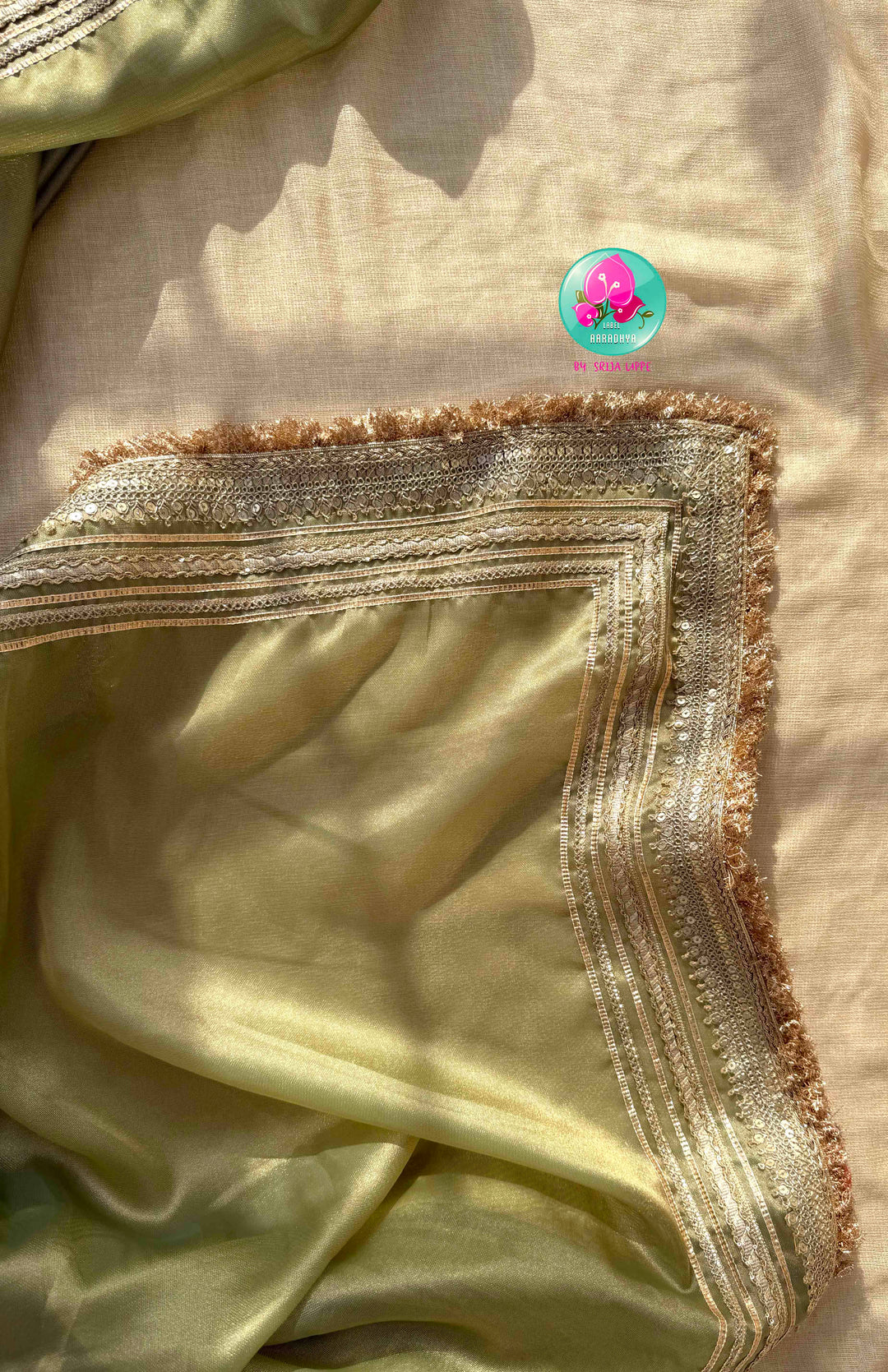 Ethereal Metallic Glow: Light Green Gold Tissue Organza Saree & Sunburst Orange Brocade Blouse