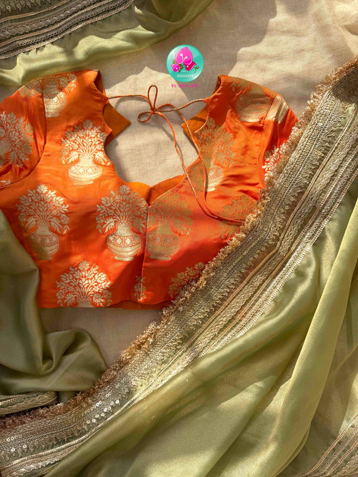 Ethereal Metallic Glow: Light Green Gold Tissue Organza Saree & Sunburst Orange Brocade Blouse