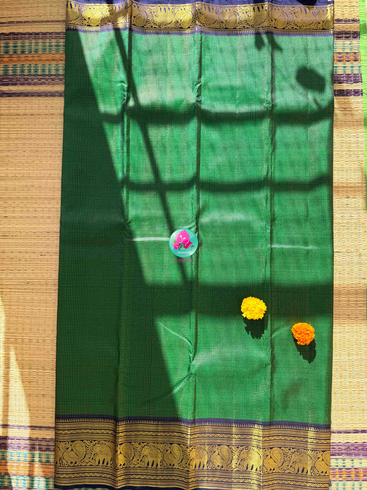 Peacock Splendor: Emerald Green Vaira Oosi Kanchipattu Silk Saree & Royal Blue Maggam Blouse