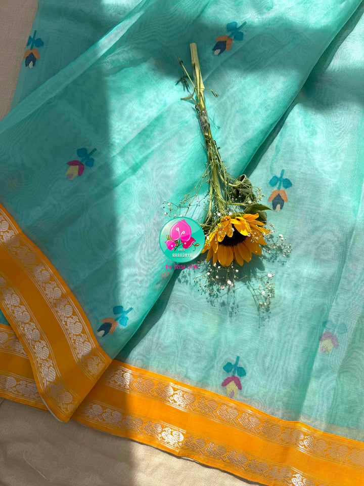 Ethereal Aquamarine & Mustard Fusion: Blue Jamdani-Kanchiorganza Silk Saree with Mustard Silk Blouse