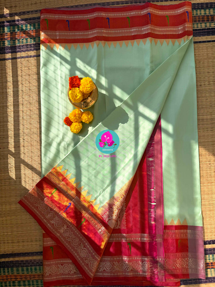 Emerald & Amber: Radiant Green Pure Tissue Gadwal Saree with Luminous Copper Muniya Border & Jeweled Blouse