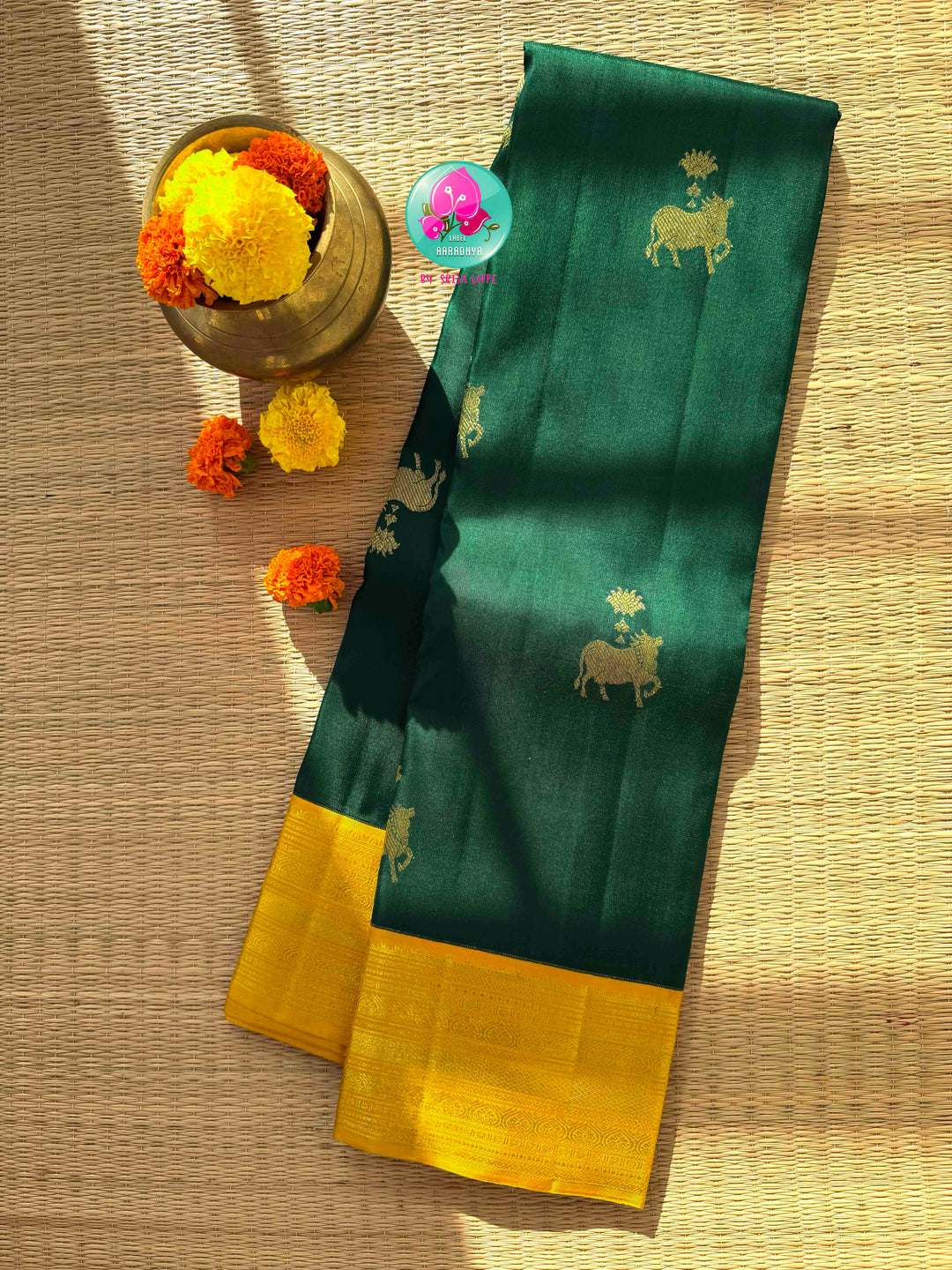 Sacred Pichwai Reverence: Bottle Green Pure Kanjeevaram Saree with Mustard Korvai Border & Kamadhenu Art