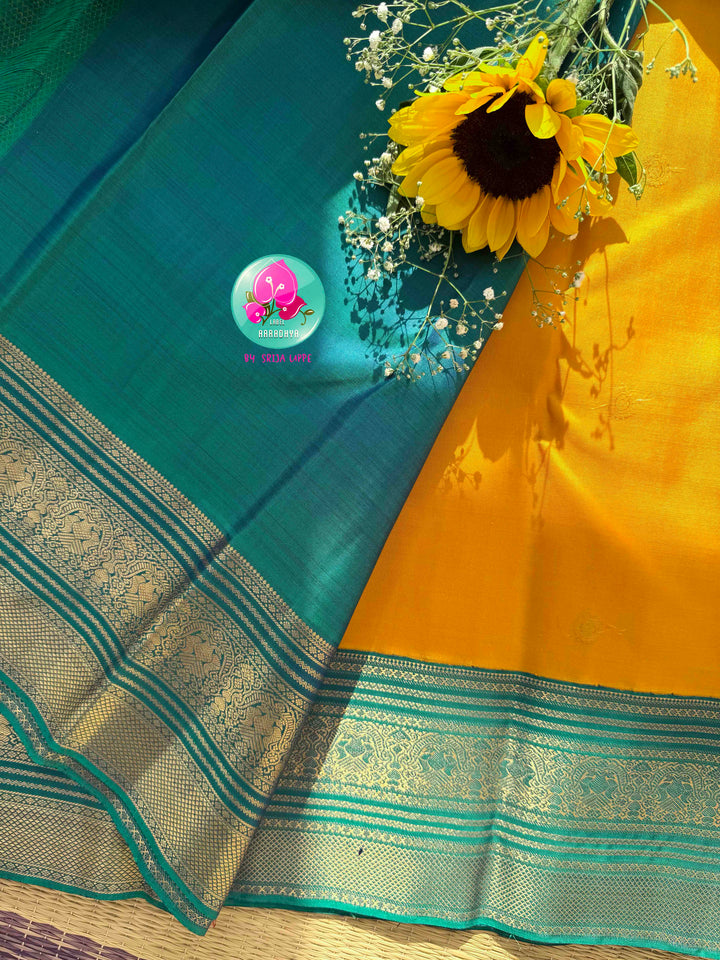 Vintage Radiance & Peacock Jewel: Mustard Yellow Pure Kanjeevaram Saree with Peacock Blue-Green Border