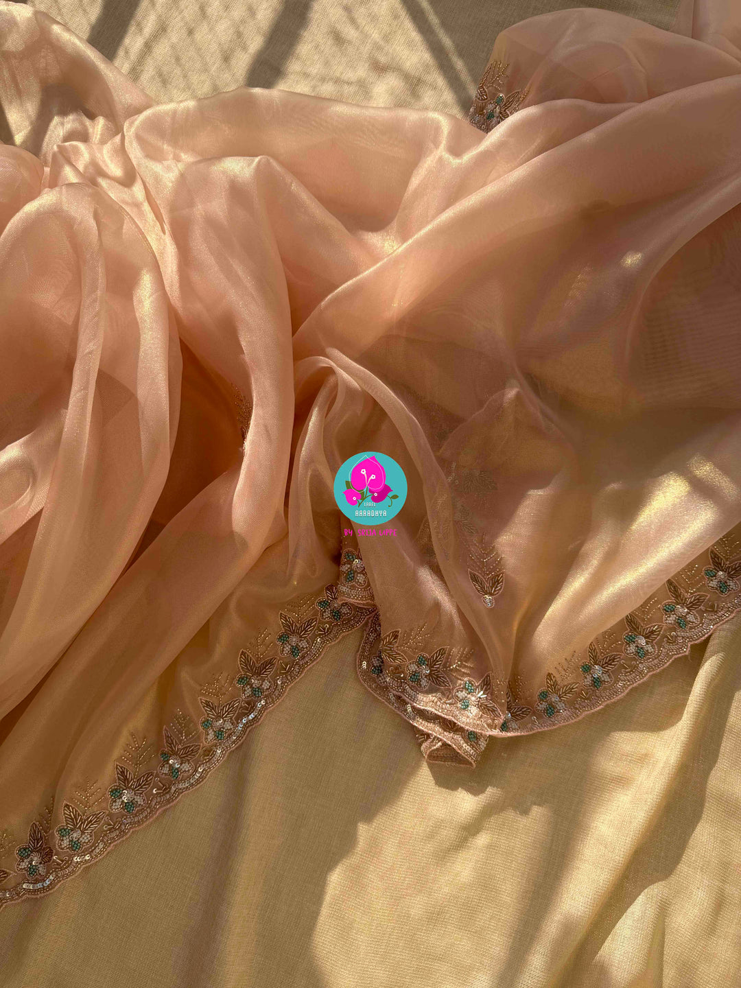 Nectar & Moonlight: Hand-Embroidered Peach & Rose Gold Tissue Saree