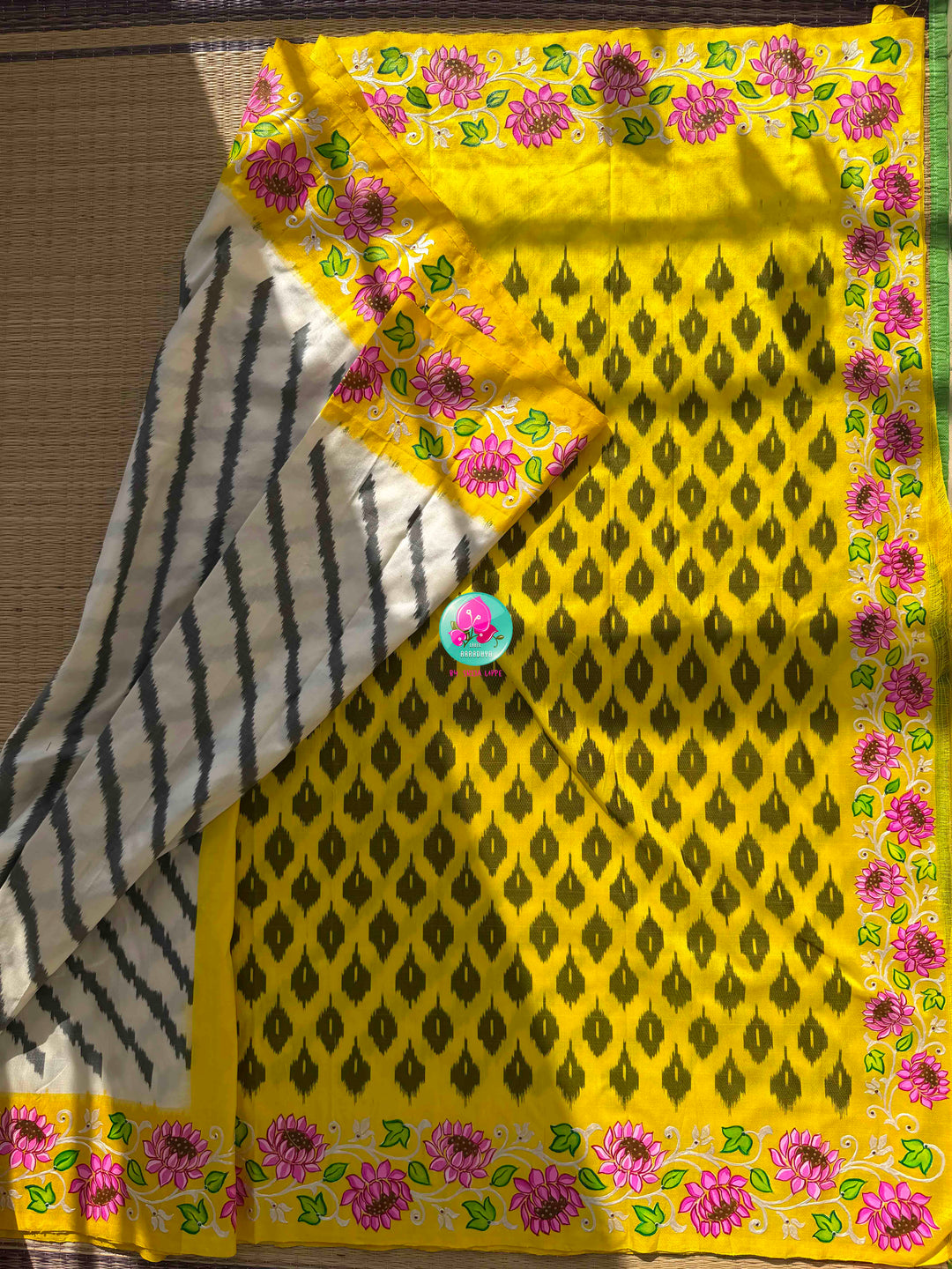 A Heritage Fusion: Hand-Painted Tanjore Lotus Pure Ikkat Silk Saree