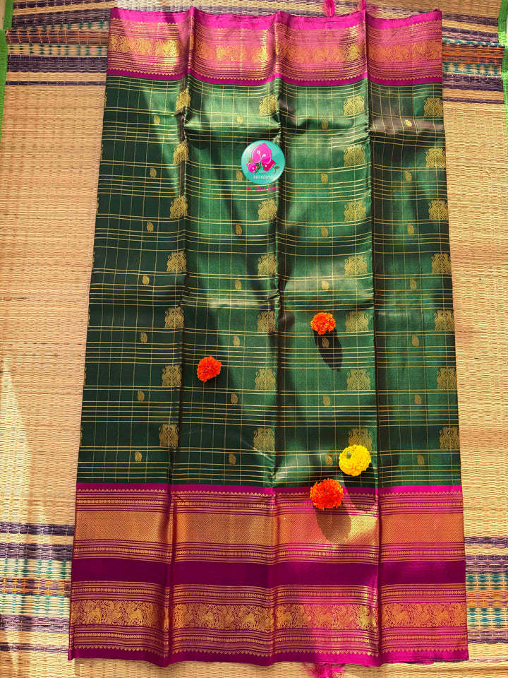 Majestic Heritage Classic: Bottle Green Kanchipattu Silk Saree with Magenta Pink Korvai Border & Maggam Blouse