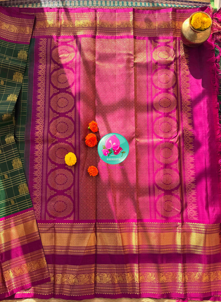 Majestic Heritage Classic: Bottle Green Kanchipattu Silk Saree with Magenta Pink Korvai Border & Maggam Blouse