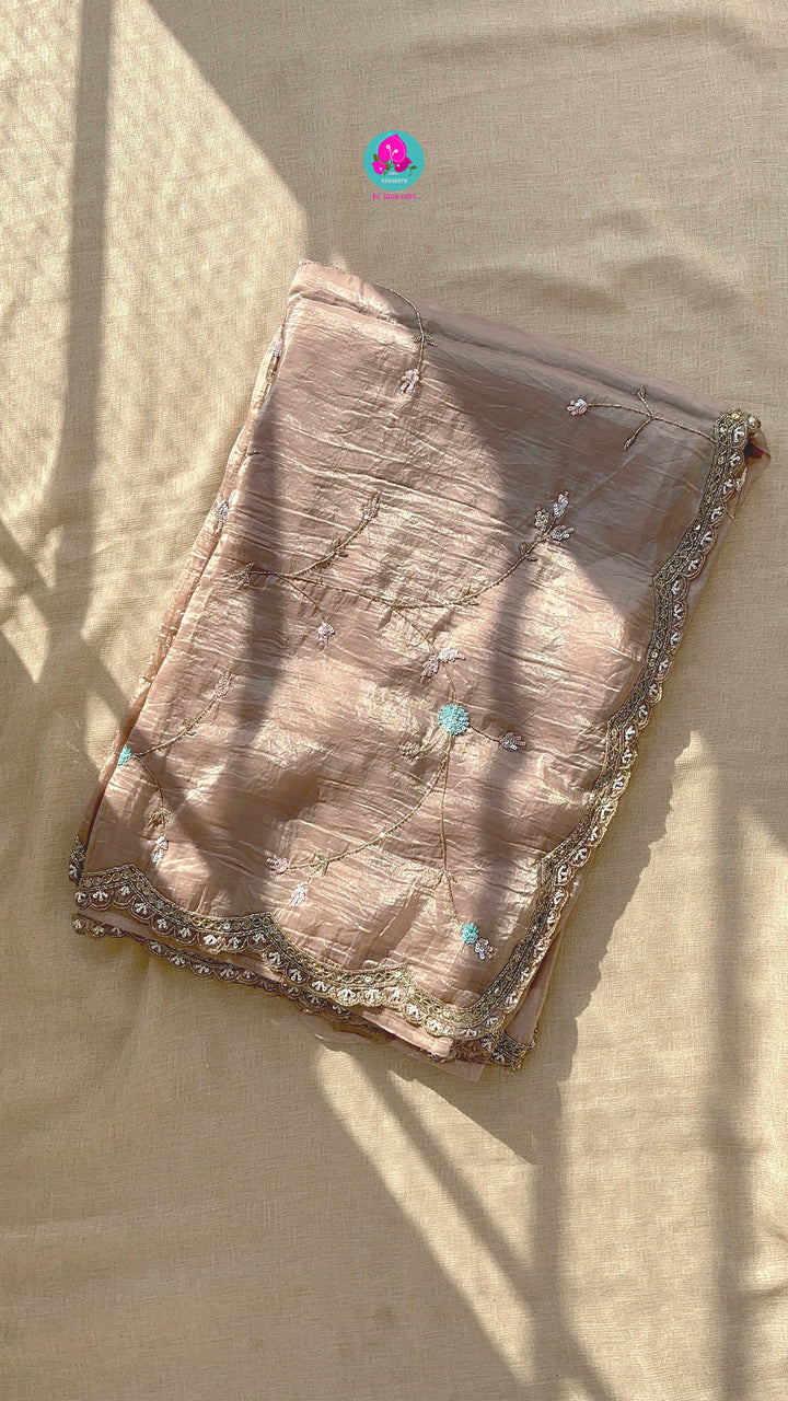Soft crushed organza hand embroidered saree paired with Hand Embroidered tissue silk blouse