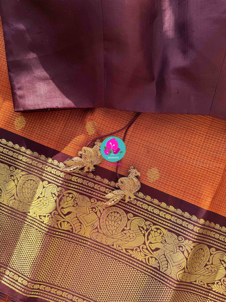 Deep Rust Kanchipuram Silk with Gilded Vaira Oosi & Hand-Embroidered Elegance
