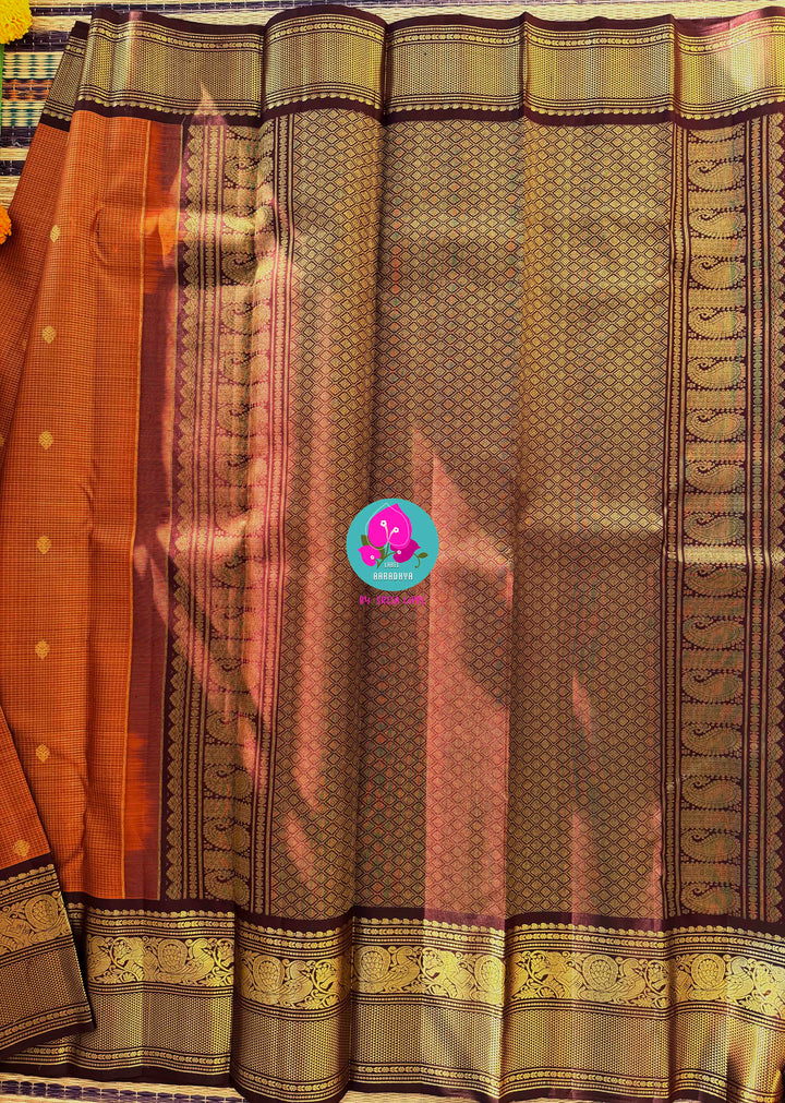 Deep Rust Kanchipuram Silk with Gilded Vaira Oosi & Hand-Embroidered Elegance