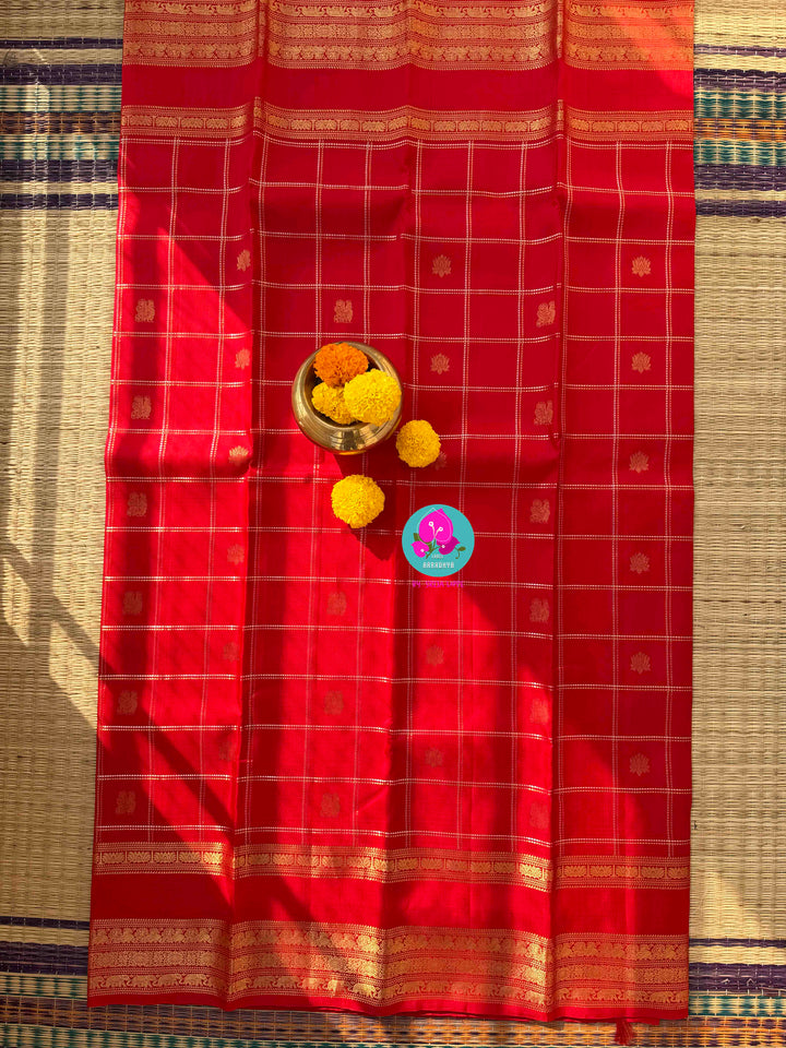 Eternal Radiance: Crimson Red Pure Kanchipattu with Gilded Zari & Hand-Embroidered Peacock Artistry