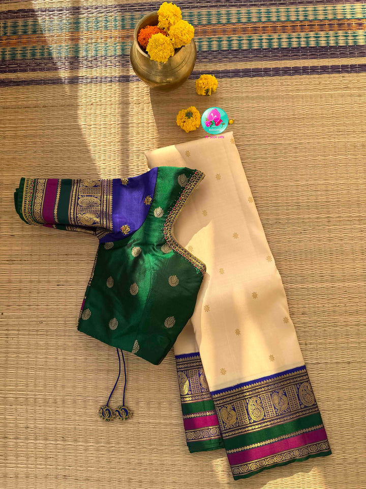 Understated Ivory Regalism: Cream Kanchipattu Silk Saree with Multi-Tone Heritage Border & Designer Maggam Blouse